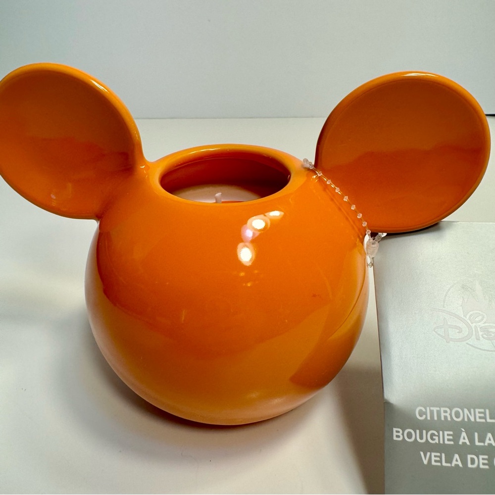 NWT. Disney Parks Mickey Mouse Icon Orange Citronella Ceramic Candle.